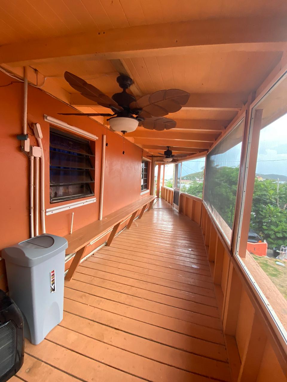 Covered wraparound deck at 60 Anna's Fancy